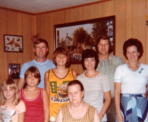 Mom in front. L-R: Christie, Roby, Kevin, Pat, Mildred, ERay, Billy.